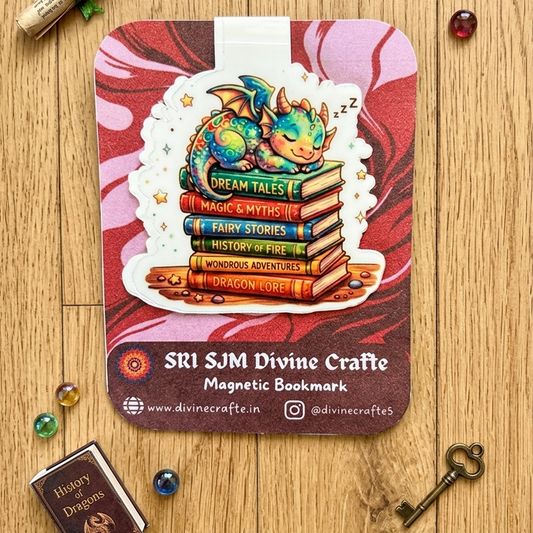Sleeping baby dragon on fantasy book stack magnetic bookmark by Sri SJM Divine Crafte on red marble background